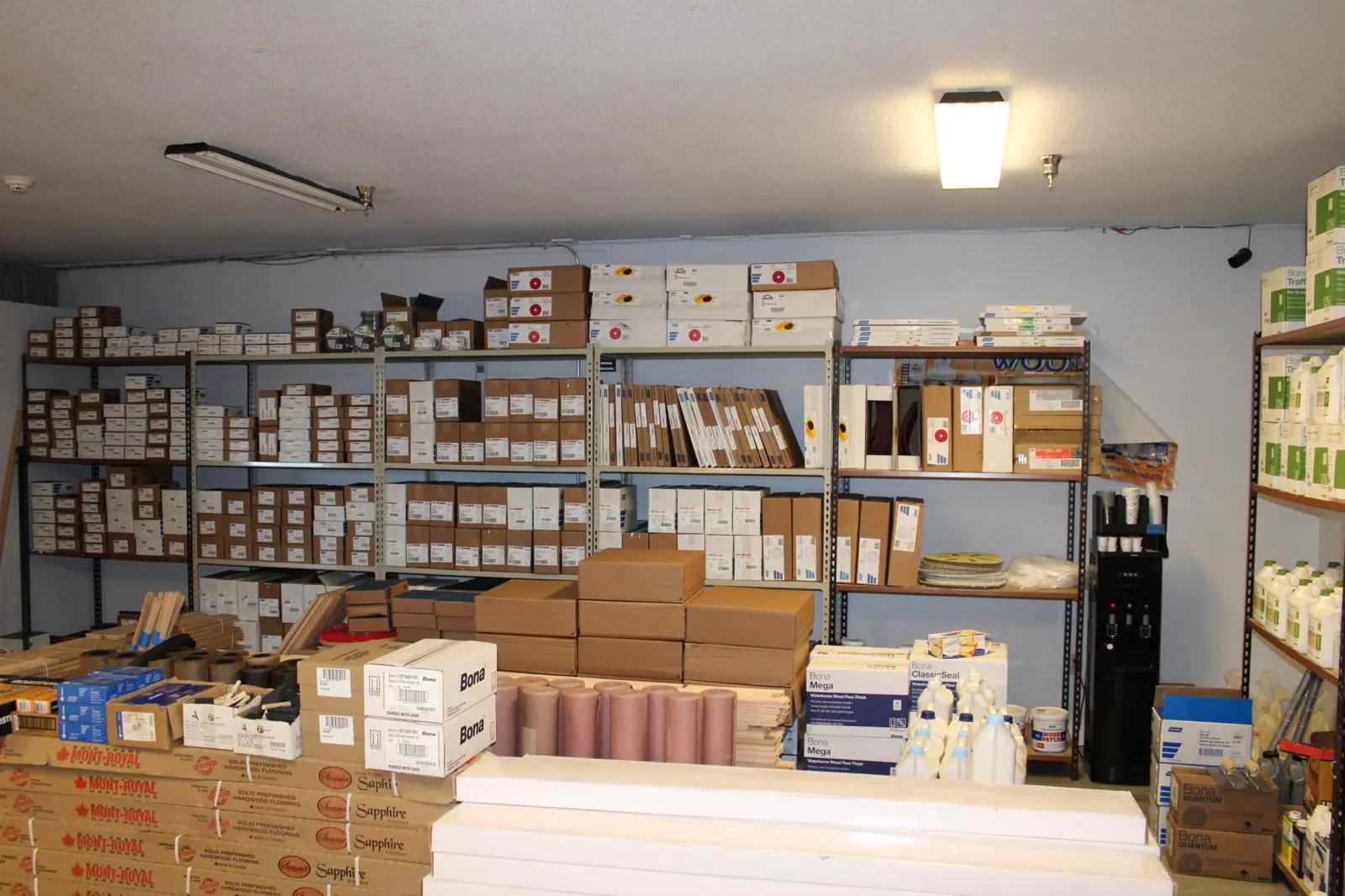 Hardwood samples and stock on the floor at the JR Hardwood Supplies showroom in Falmouth, MA